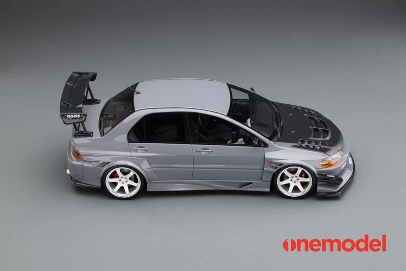 One Model 1:18 Mitsubishi Lancer Evolution IX Voltex with Carbon Bonnet in Iron Gray