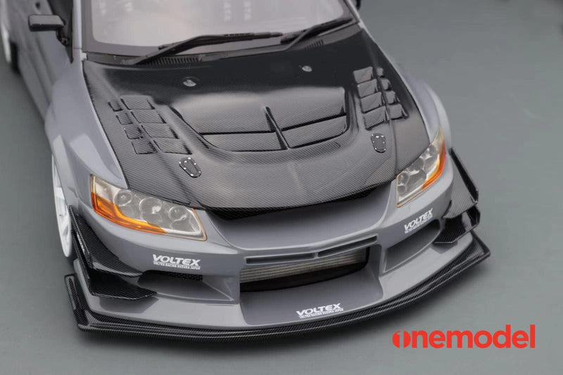 One Model 1:18 Mitsubishi Lancer Evolution IX Voltex with Carbon Bonnet in Iron Gray