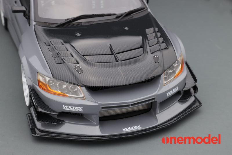 One Model 1:18 Mitsubishi Lancer Evolution IX Voltex with Carbon Bonnet in Cement Gray